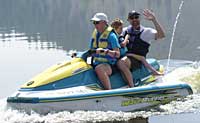 George, a young physically challenged boy, gets to ride with his mom and dad on Lake Shastina on a personal watercraft from The Fun Factory!