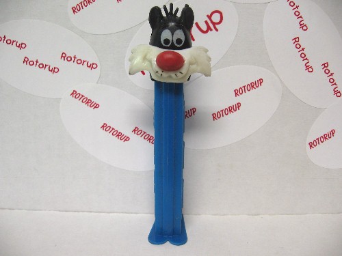 PEZ two Sylvesters cream faces with whiskers cream face; black head/blue head 